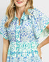 Woman wearing a floral dress with a white background