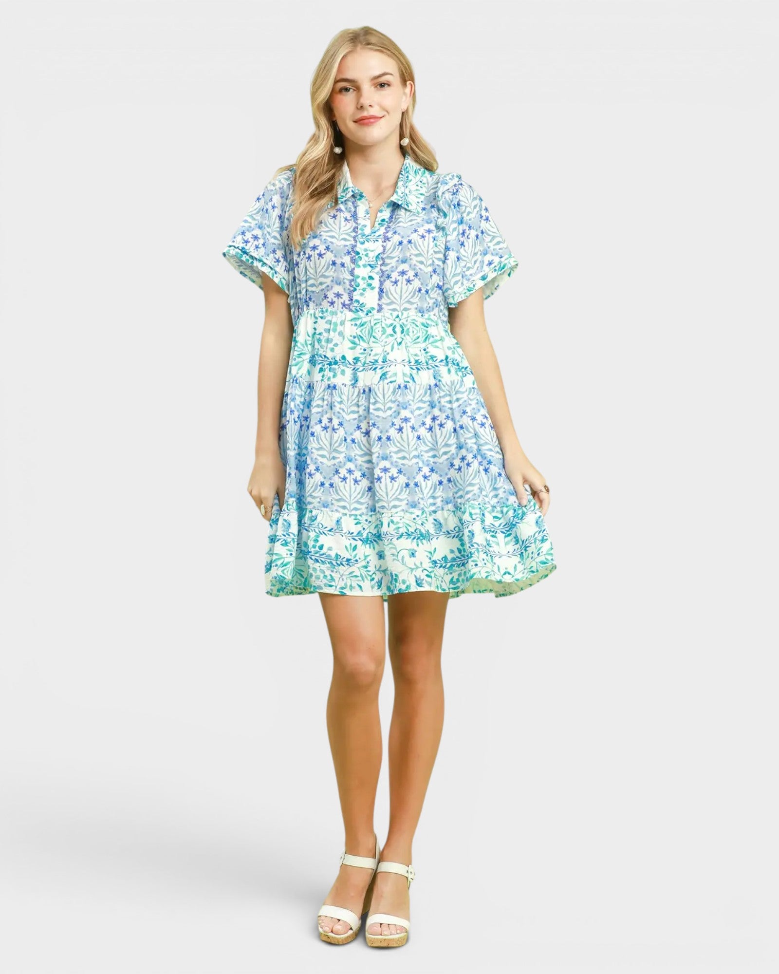 Woman wearing a floral dress on a white background