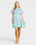 Woman wearing a floral dress on a white background