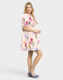 Woman wearing a floral dress on a white background