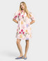 Woman wearing a floral dress on a white background