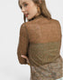 Woman wearing a brown floral blouse on a white background
