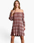 A woman modeling an off-the-shoulder, long-sleeve mini dress with a textured, tie-dye-like horizontal stripe pattern in dusty rose and mauve tones, set against a plain white studio background.