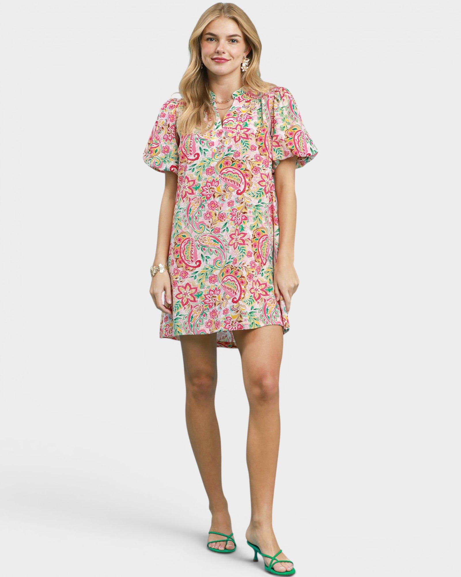 Woman wearing a floral dress on a white background