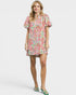 Woman wearing a floral dress on a white background