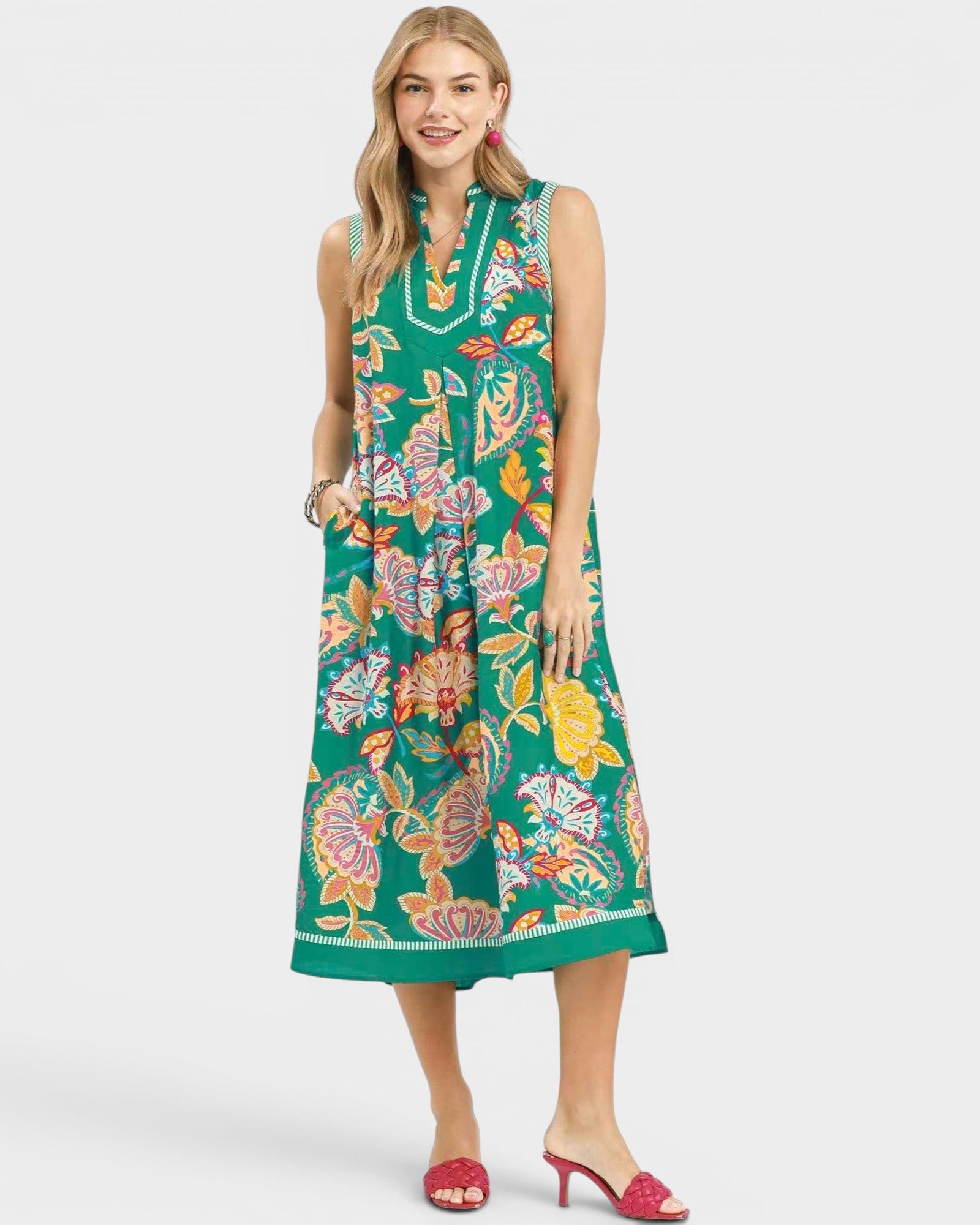 woman wearing green paisley floral midi dress