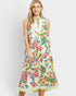 Woman wearing a colorful floral dress on a white background