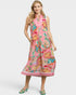 Woman wearing a pink floral dress on a white background