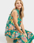 woman wearing green paisley floral midi dress