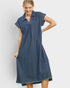 Woman wearing a blue pinstripe dress on a white background