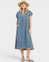 Woman wearing a blue striped dress and straw hat on a white background