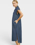 Woman wearing a blue striped dress on a white background