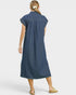 Woman wearing a blue striped dress on a white background