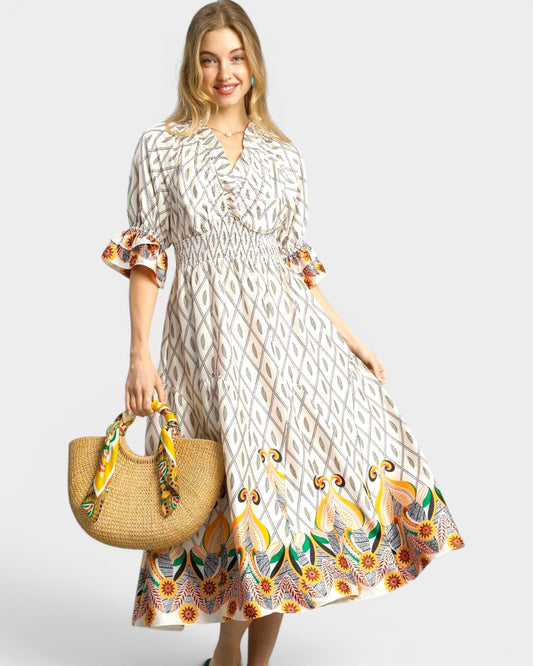 Woman wearing a patterned dress holding a straw bag with a decorative ribbon on a white background