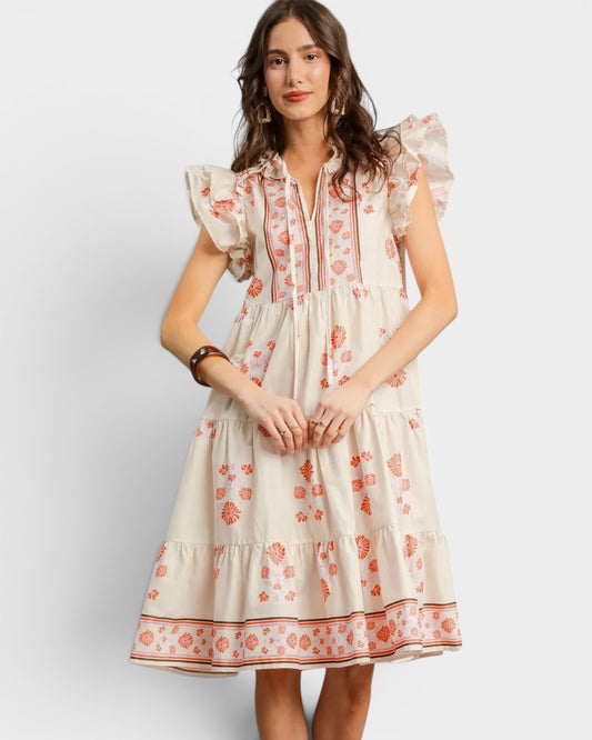Woman wearing a floral dress on a white background