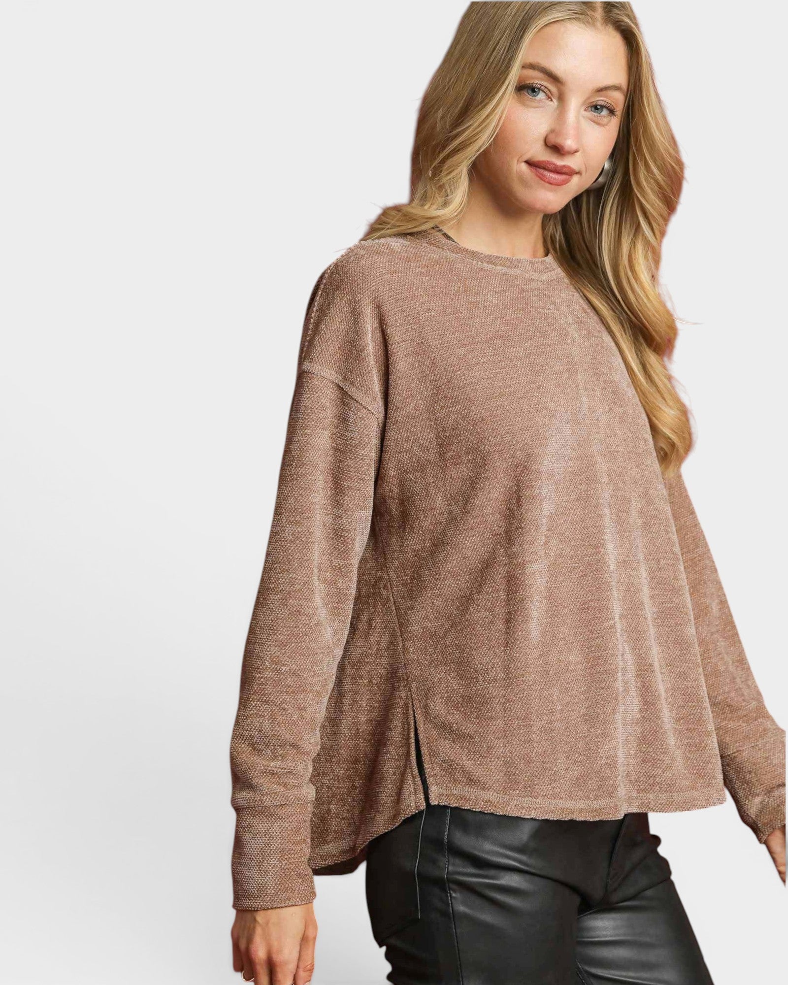 Woman wearing a brown sweater on a white background