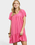 Woman wearing a pink dress on a white background
