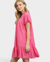 Woman wearing a pink dress on a white background