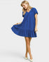 Woman wearing a blue dress on a white background