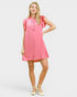 Woman wearing a pink dress on a white background
