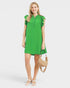 woman wearing a green mini dress