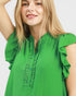 woman wearing a green mini dress