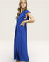 Woman wearing a blue dress with ruffled shoulders on a white background