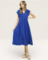 Woman wearing a blue dress with ruffled sleeves on a white background