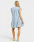 Woman wearing a blue and white striped dress on a white background