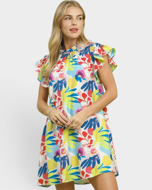 Woman wearing a colorful floral dress on a white background
