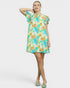 Woman wearing a floral dress on a white background