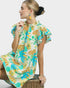 Woman wearing a colorful dress with a white background