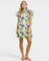 Woman wearing a colorful floral dress on a white background