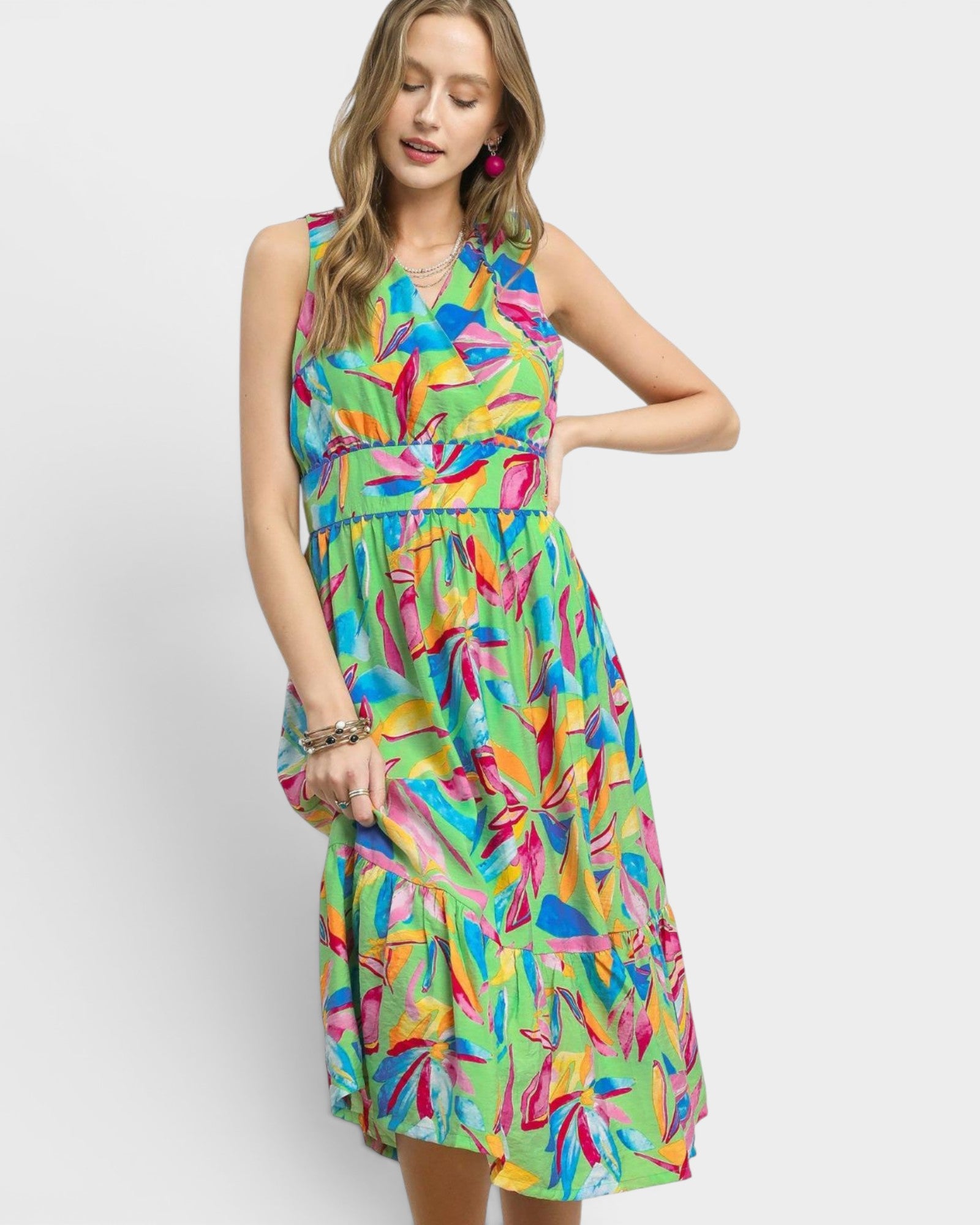 Woman wearing a colorful dress with a white background