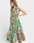 Colorful dress with floral pattern worn by a model on a white background