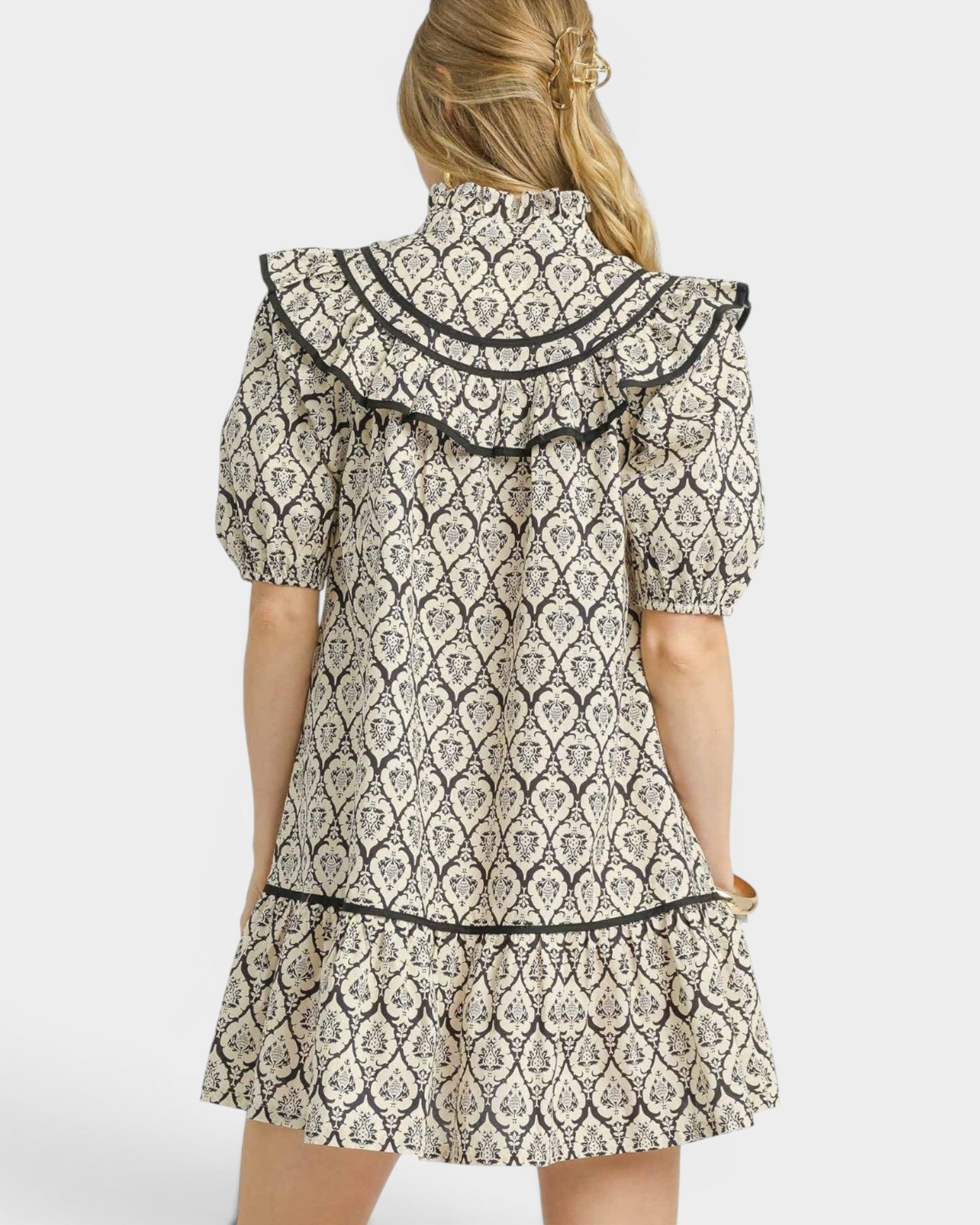 Patterned dress with a hood on a white background