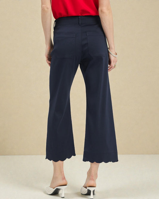 Navy blue wide-leg pants worn by a person on a beige background