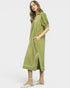 Woman wearing a green dress with white trim on a white background