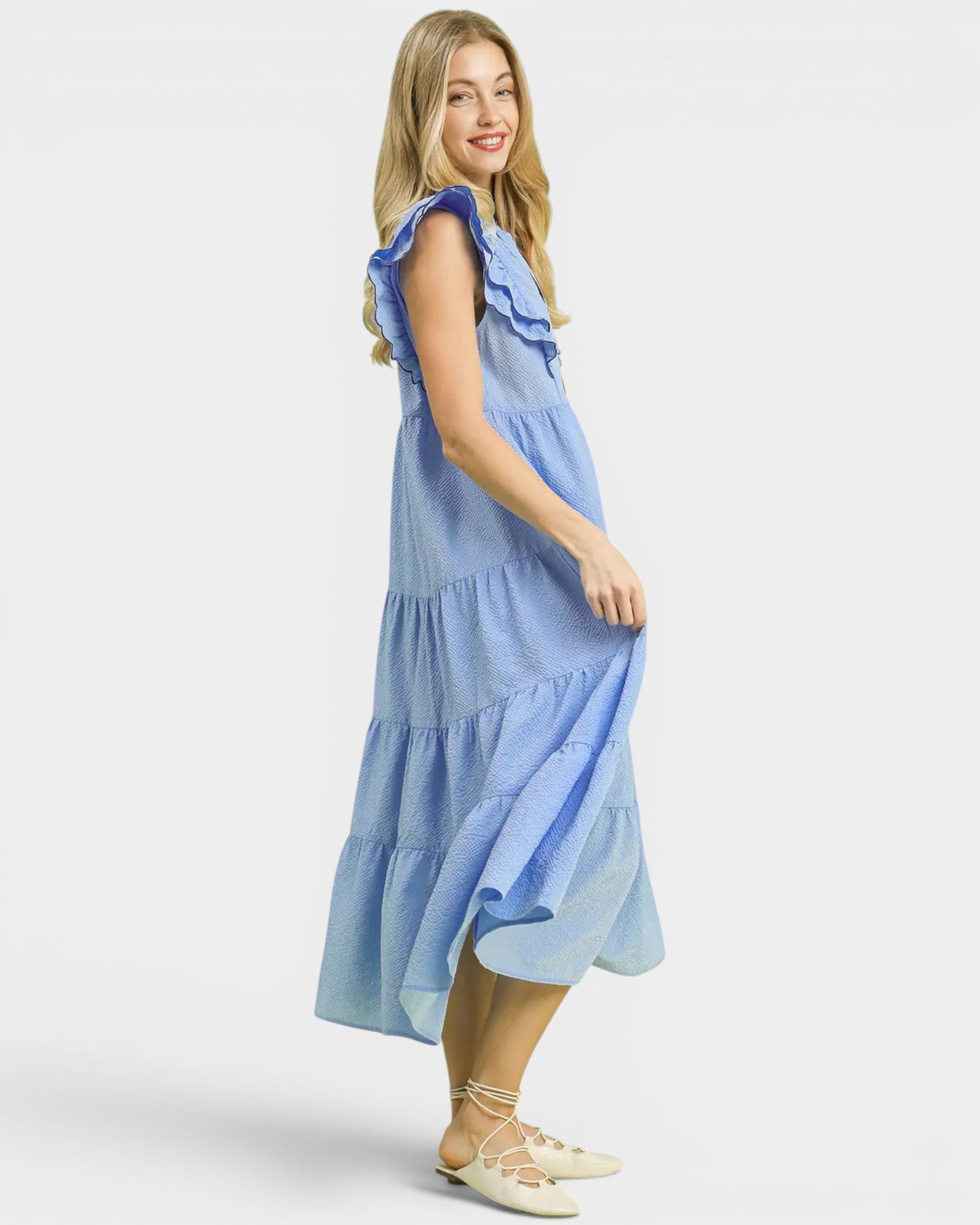 Woman wearing a blue dress on a white background