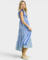 Woman wearing a blue dress on a white background