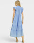 Woman wearing a light blue dress with ruffled sleeves on a white background