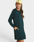 Woman wearing a green dress with a plain background