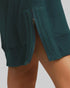 Teal shorts with a textured pattern on a plain background