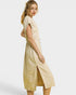 Woman wearing a beige dress on a white background