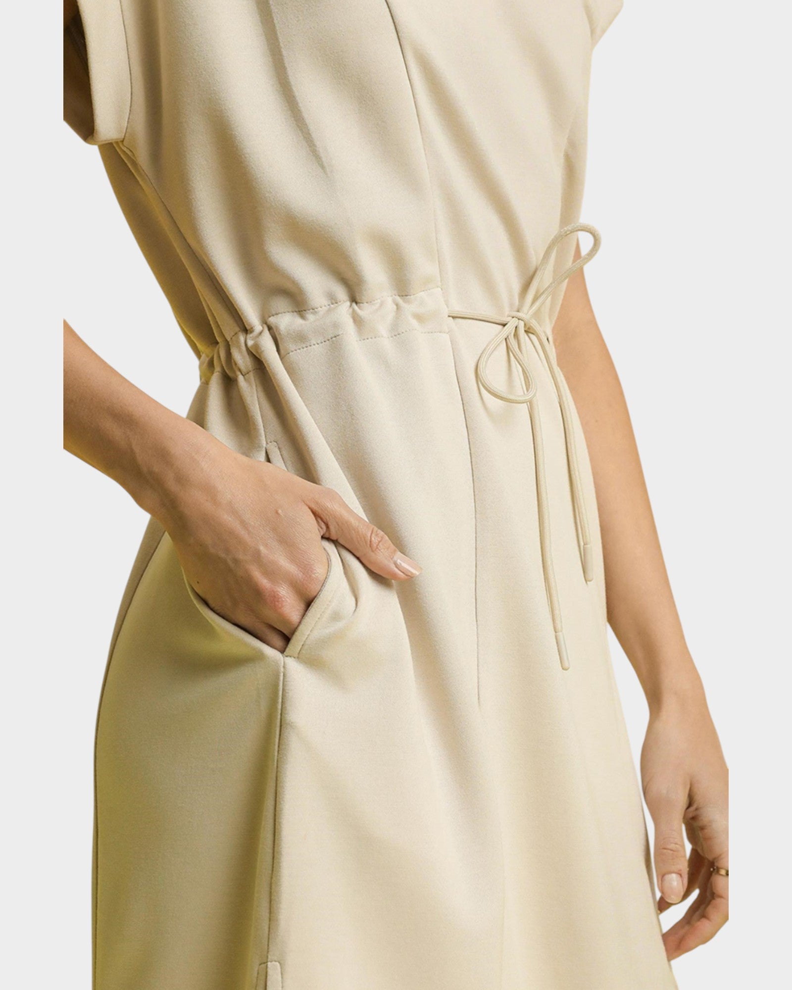 Beige dress with a drawstring waist on a white background