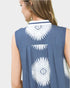 Blue sleeveless top with white floral patterns on the back against a light gray background