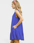 Woman wearing a blue dress with a white background