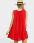Woman wearing a red dress and straw hat on a white background