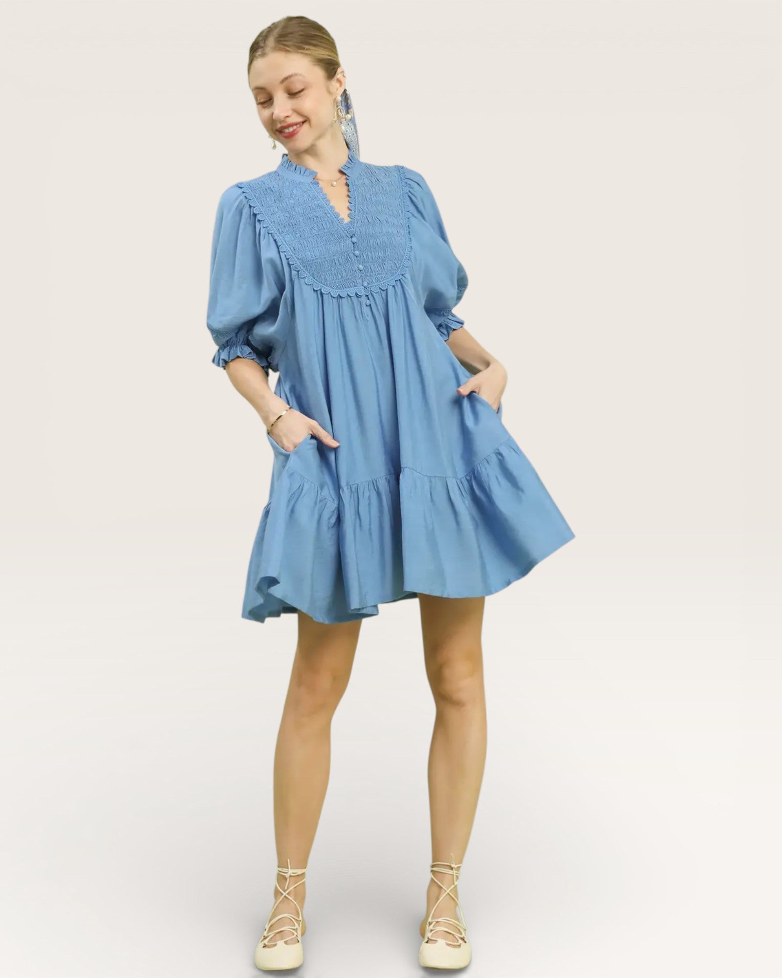 Woman wearing a blue dress on a white background