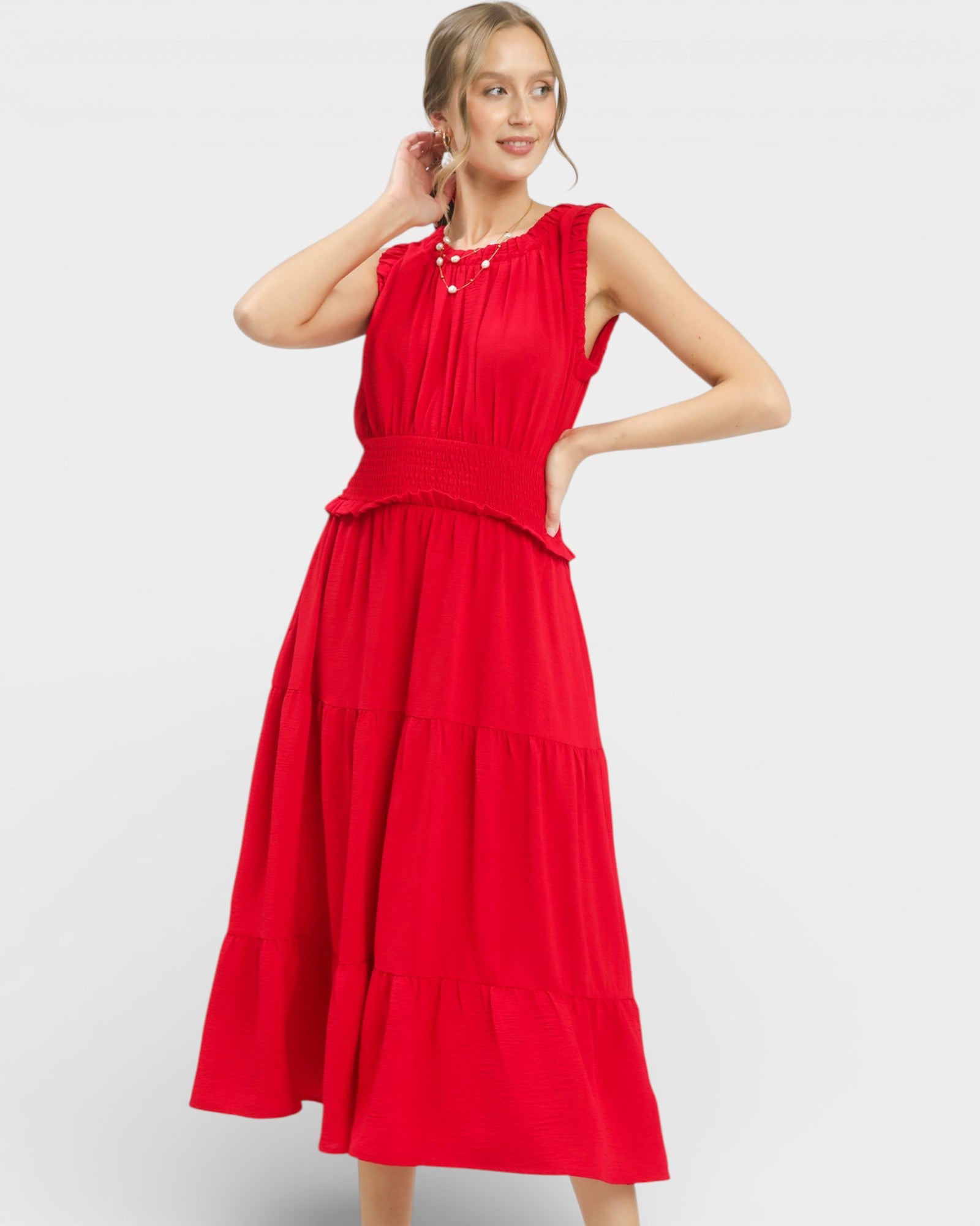 Woman wearing a red dress on a white background